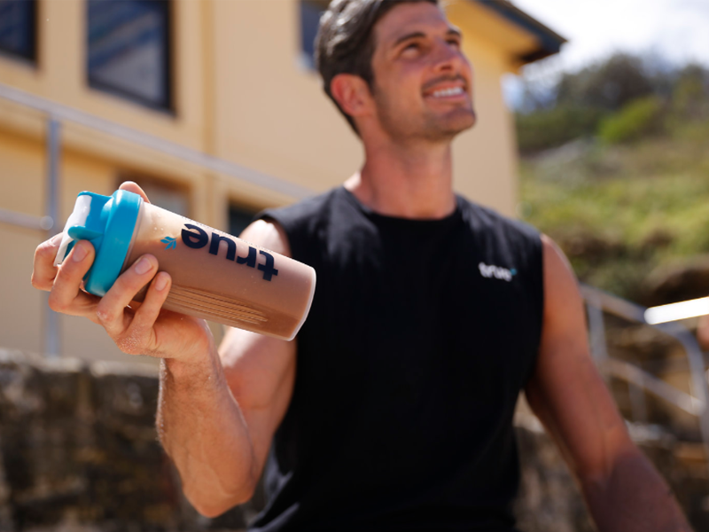 man with protein shake
